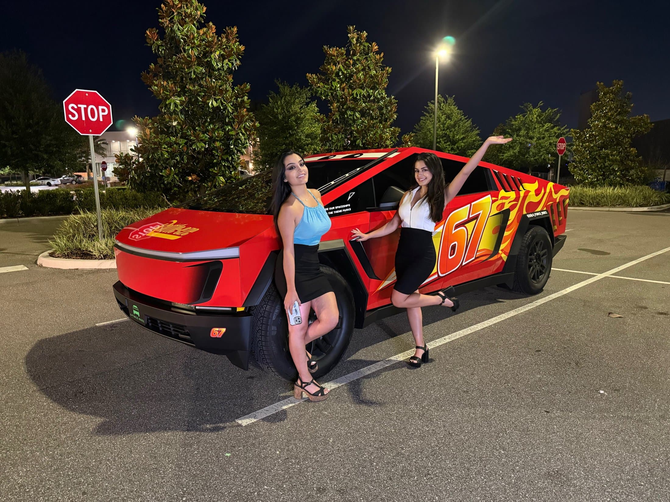 G-Force Ridez flagship Red 67 Racing Unit — the red number-67 Cybertruck with two riders