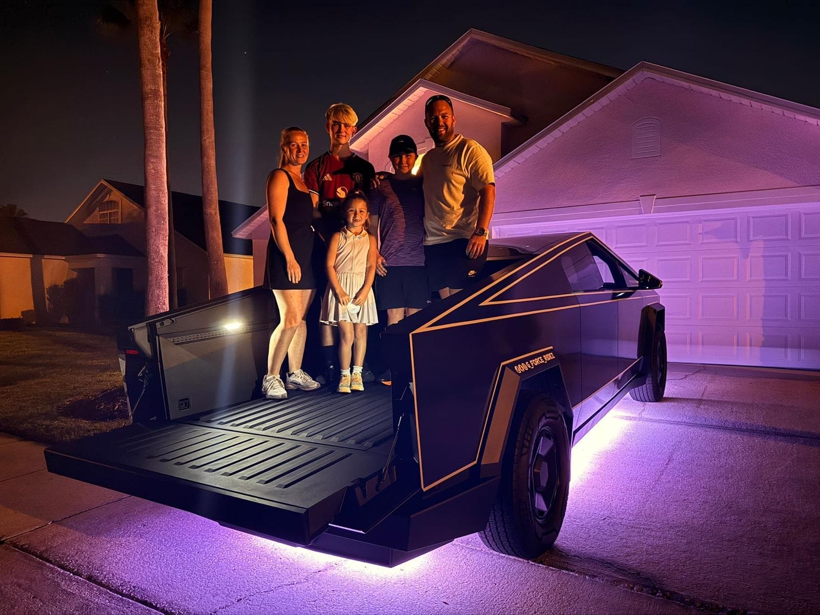 Family enjoying the G-Force Ridez Cybertruck at night